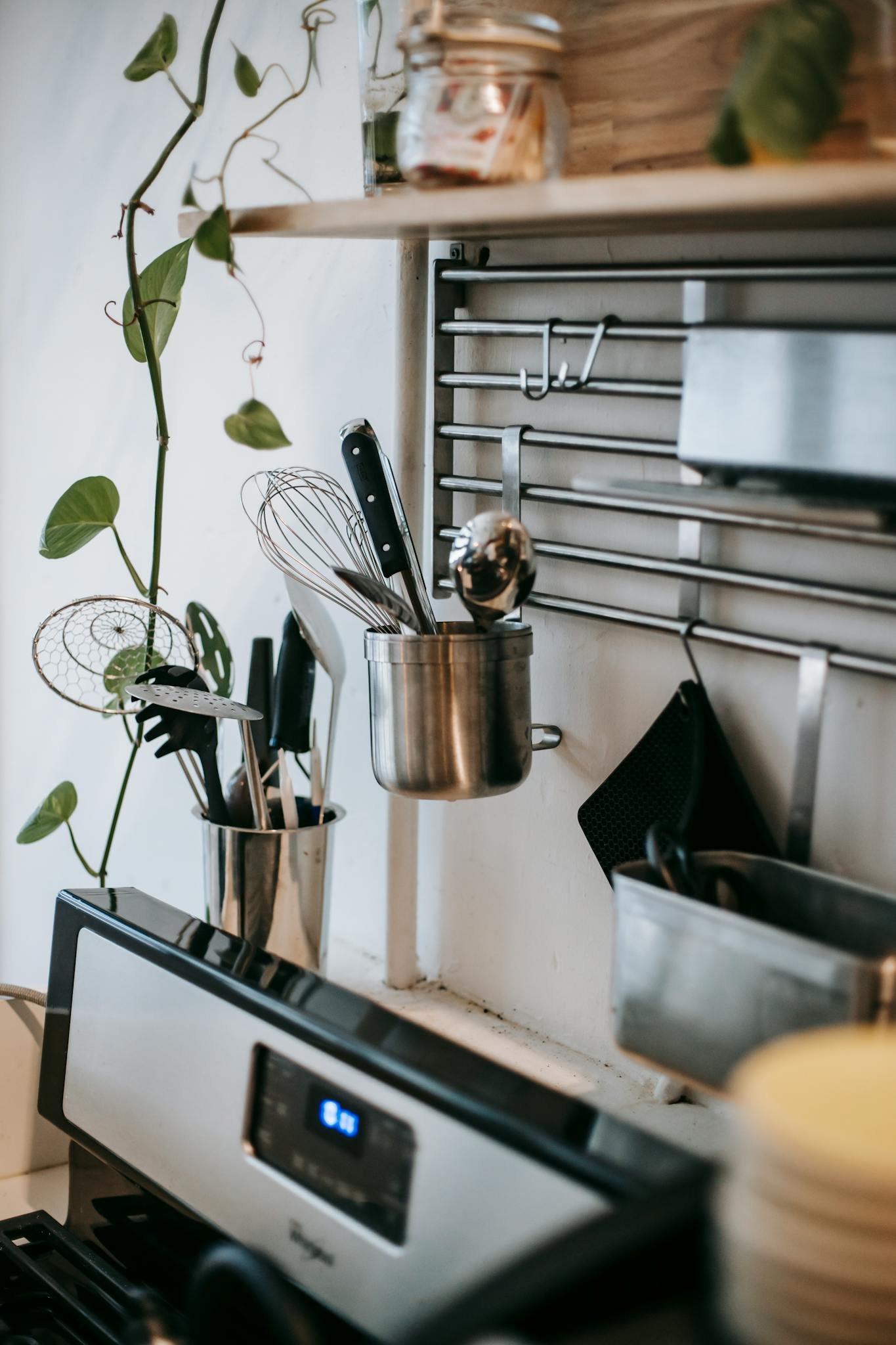 A stylish kitchen setup featuring stainless steel tools and cookware with a sleek design.
