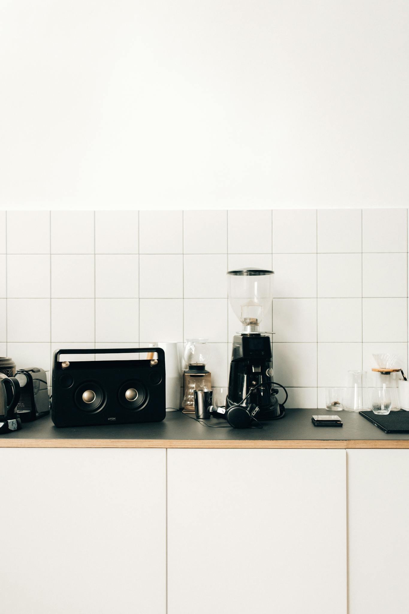 Stylish kitchen setup with a coffee maker and sleek design elements on a minimalist counter.
